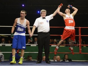 Myles Casey (red) celebrates winning his first Elite title in January